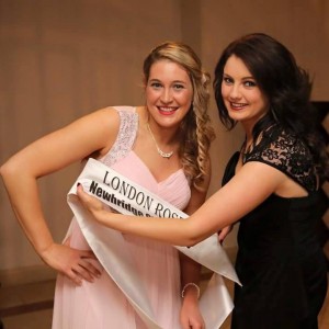 Aisling is presented with her sash by last year.s rose Seoirse Ni Fhaitnain.